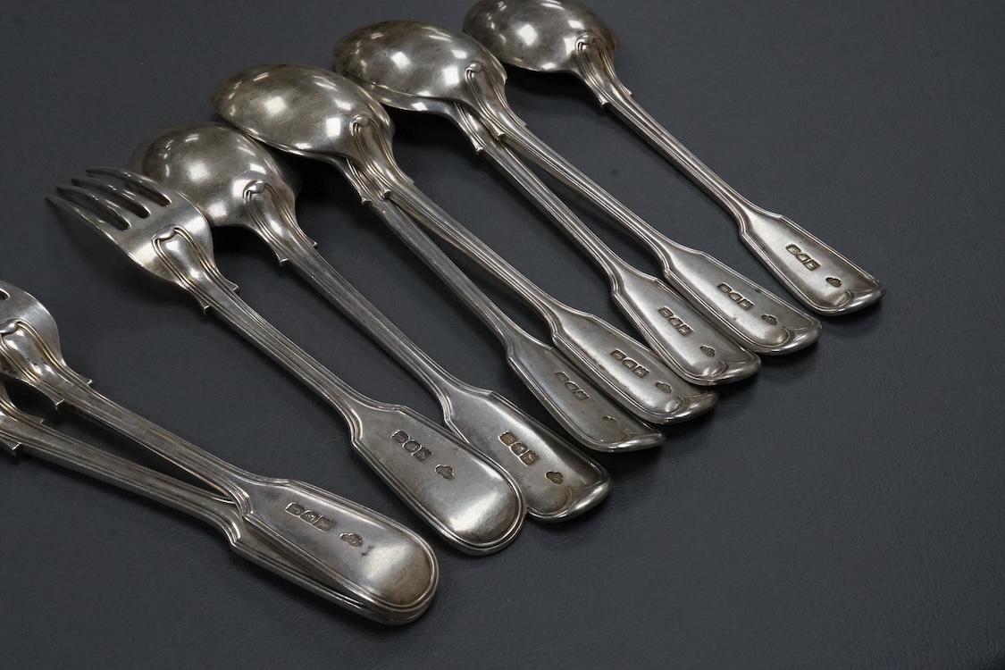 A set of six Edwardian silver fiddle and thread pattern table spoons, overstruck maker's marks, possibly Goldsmiths & Silversmiths Co Ltd, 21.6cm, and three matching table forks, London, 1901, 27.9oz.